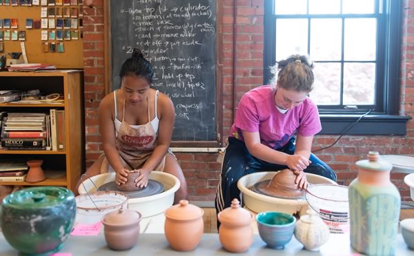 Female students making pottery